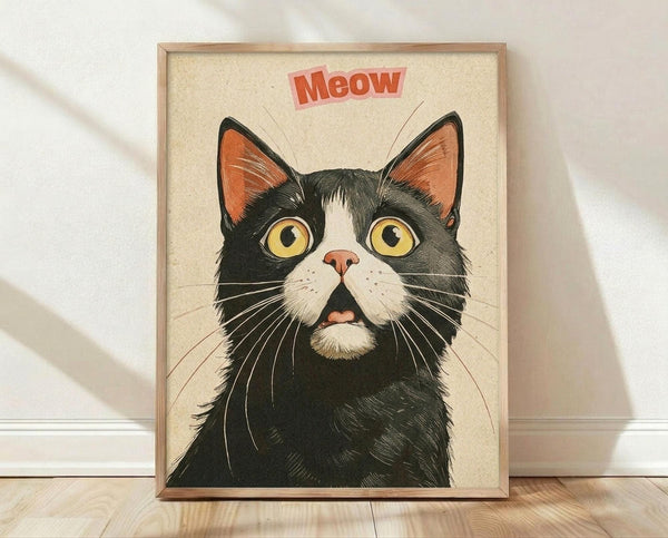 May include: Framed poster print featuring a black and white tuxedo cat with large yellow eyes and orange inner ears against a cream textured background, with red "Meow" text above. The artwork has a vintage illustrated style with detailed whiskers and fur texturing. Light wood frame sits on wooden floor against white wall with soft natural lighting creating shadows.