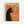 Vintage-style poster featuring a stylized black cat silhouette smoking a cigarette against an orange-red background. The cat has pointed ears, green eyes, and visible whiskers, with pale green smoke curling upward. French text appears at the top and bottom in cream and white lettering. The poster is displayed in a light wooden frame against a white wall, showing mid-century modern illustration aesthetic with bold geometric shapes and retro color palette.