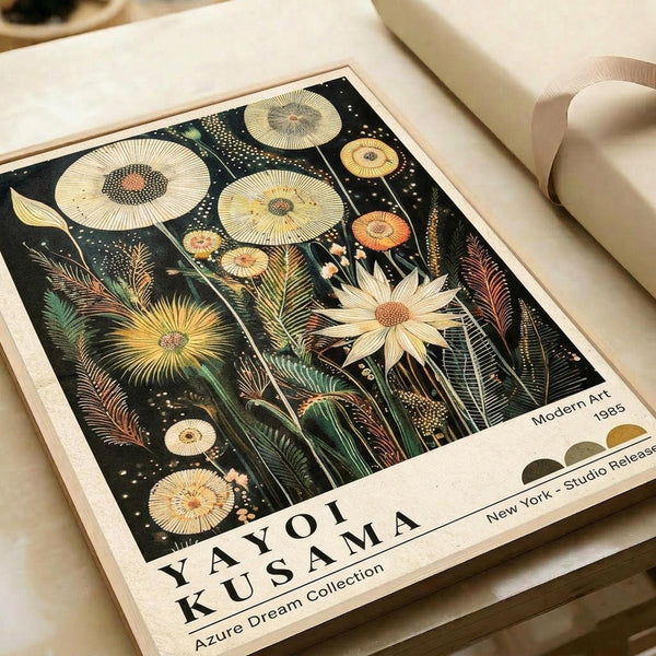 Botanical art print featuring stylized mushrooms, flowers, and plants in golden yellow, cream, and orange tones against a dark background. The vintage-style illustration shows detailed spore patterns, feathery ferns, and radiating flower petals with white dots scattered throughout. Print has cream borders with text at bottom and sits on white paper with beige ribbon nearby.