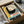May include: Vintage Bauhaus poster print in black frame, packed in cardboard shipping box with protective tissue paper. Features geometric design with concentric circles forming an eye motif in cream, yellow, black and teal colors. German text reads "OFFSET BUCH UND WERBEKUNST HEFT 7" at bottom. Modernist 1920s typography and abstract graphic elements visible.