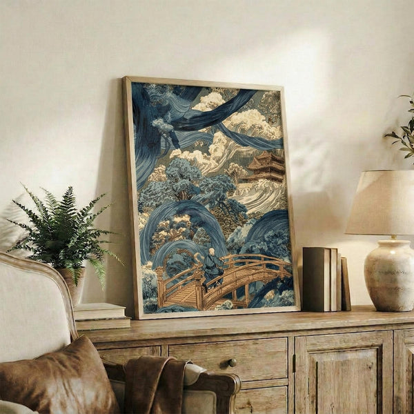 May include: Japanese woodblock print artwork in wooden frame showing dramatic blue swirling waves and clouds with a wooden bridge and small figure, displayed on rustic wood console table alongside potted fern, books, and ceramic vessels in neutral-toned living room setting