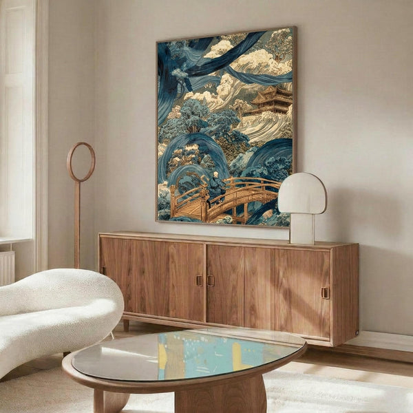 May include: Japanese woodblock print artwork displayed above walnut credenza in modern living room. Print features dramatic blue ocean waves, golden temple buildings, and figure crossing wooden bridge in traditional ukiyo-e style. Room has cream walls, white curved chair, glass coffee table, and brass floor lamp.