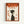 Framed poster with orange and cream color scheme featuring a minimalist illustration of a person in profile wearing a dark green turtleneck. The design includes "ZEN" in large orange letters at the top, Japanese text, and geometric orange square elements scattered around the composition. The poster has a vintage-inspired aesthetic with textured paper appearance and is displayed in a light wood frame against a white wall.