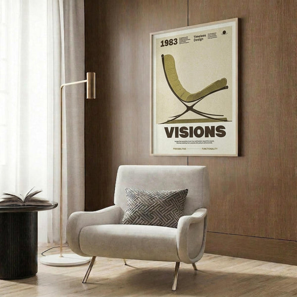 May include: A framed beige vintage-style poster featuring a green mid-century modern chair design with "VISIONS" text, displayed on wood-paneled wall above a cream upholstered armchair with geometric pillow, next to a brass floor lamp and dark round side table with open book.