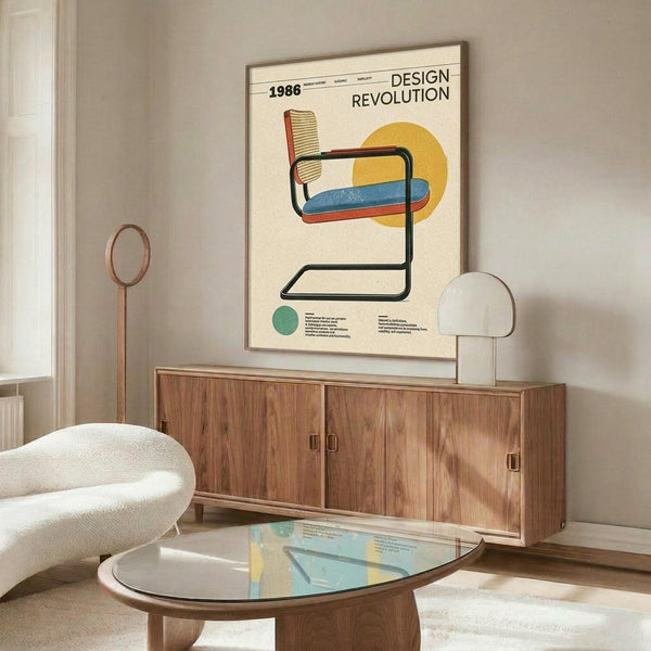 May include: Mid-century modern living room mockup showing cream-colored poster in thin frame above walnut credenza. Poster features colorful cantilever chair illustration with woven cane back, blue and red cushions, yellow circle background, and "1986 DESIGN REVOLUTION" text. White sculptural chair and glass-top coffee table in foreground, warm natural lighting creates shadows across wood surfaces.