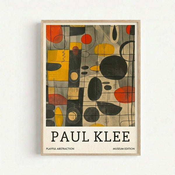 May include: Framed abstract art print in light wood frame hanging on white wall. Artwork features geometric shapes, circles, and organic forms in muted colors including orange, yellow, olive green, and beige arranged in grid-like composition. Text below reads "PAUL KLEE" with "PLAYFUL ABSTRACTION" and "MUSEUM EDITION" in smaller print on cream background.