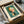 May include: Framed Kandinsky abstract art print in protective packaging within cardboard shipping box. The artwork features geometric shapes in orange, coral, and white against a teal-green background, with "Empor (Upward) Bauhaus Dessau 1924" text below. Cream matting surrounds the print in black frame, nestled in white tissue paper.