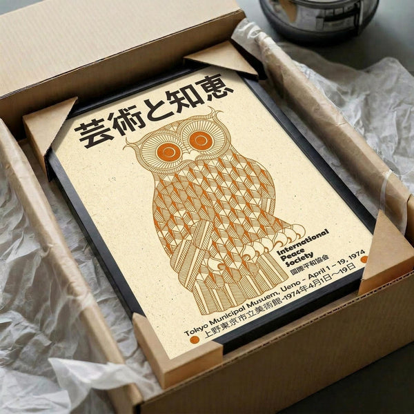 May include: Vintage-style poster featuring a geometric owl design in warm orange and brown tones on cream paper, displayed in black frame inside wooden shipping box with tissue paper wrapping. Japanese text at top, English text below indicating Tokyo Municipal Museum exhibition dates from 1974. Owl rendered in intricate line art with patterned feathers and circular eyes.