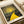May include: Framed art print featuring Yayoi Kusama's distinctive pointillist style with bright yellow sun radiating concentric circles, winding yellow path through cosmic dark landscape dotted with colorful orbs, displayed on white surface with cream ribbon nearby