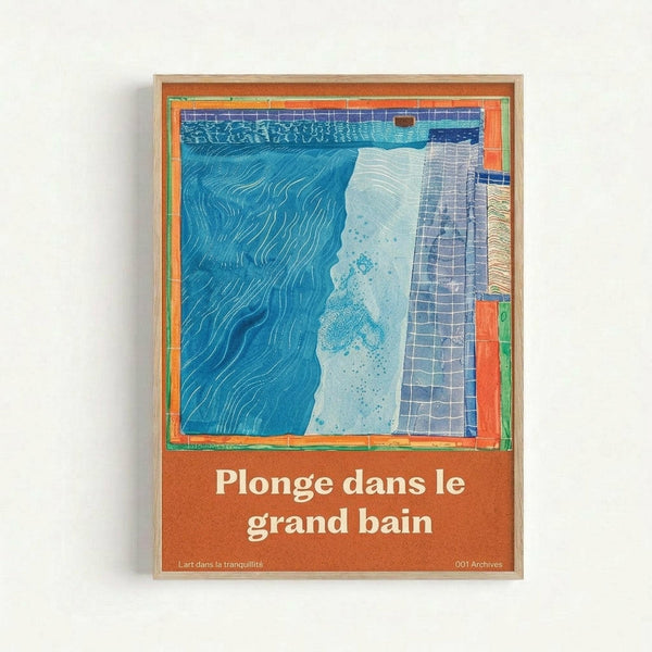 Framed poster with illustrated swimming pool scene featuring deep blue water with flowing lines, light blue shallow area with dotted texture, and blue-gray tiled deck. Orange-red border surrounds the artwork with French text "Plonge dans le grand bain" below the illustration. Natural wood frame against white wall background.