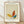 May include: Framed poster print featuring an abstract butterfly illustration in Picasso's minimalist style, with colorful geometric wings in yellow, orange, and teal against a cream textured background. The artwork shows "PICASSO" at top and "Uffizi Gallery Collection de Dessins" at bottom in dark text. Natural wood frame sits on light wooden floor against white textured wall with soft natural lighting casting shadows.