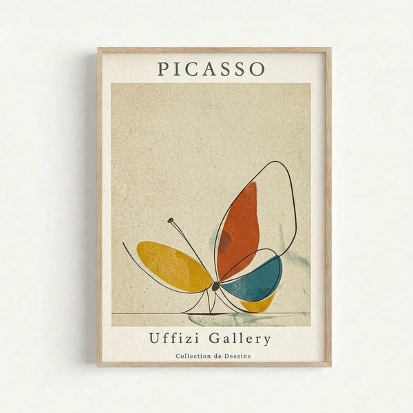 Framed minimalist butterfly artwork in Picasso's style with geometric wings in yellow, orange, teal and cream colors on beige textured background. Light wood frame mounted on white wall with "PICASSO" and "Uffizi Gallery Collection de Dessins" text above and below the butterfly illustration.