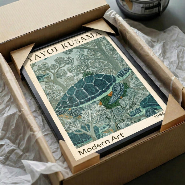 May include: Framed vintage-style poster featuring a detailed green sea turtle swimming among coral and seaweed in muted teal and sage tones, displayed in a cardboard shipping box with protective tissue paper wrapping and wooden frame components visible around the edges.