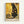 Framed art print featuring a black cat in Gustav Klimt's distinctive golden style with geometric patterns, swirls, and circular motifs throughout the composition. The cat sits elegantly against a rich yellow and gold background filled with decorative elements including squares, spirals, and ornate designs. Text below reads "NINE LIVES OF LUXURY" and "NO PAWS IN MY PLANS, ONLY PURRFECTION" in dark letters against a cream background.