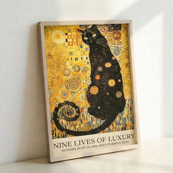 A framed art print featuring a black cat in the ornate golden style of Gustav Klimt, with intricate circular patterns, geometric designs, and rich amber and gold tones throughout. The cat sits regally against a decorative background filled with spirals, dots, and mosaic-like elements. Text at the bottom reads "NINE LIVES OF LUXURY" and "NO PAWS IN MY PLANS, ONLY PURRFECTION." The wooden frame leans against a white wall.