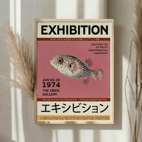 May include: Framed exhibition poster with pink background featuring detailed pufferfish illustration, displayed on white wall next to dried pampas grass. Poster shows vintage 1974 gallery exhibition design with Japanese and English text, venue details for San Francisco Japantown location, and artist names at bottom.