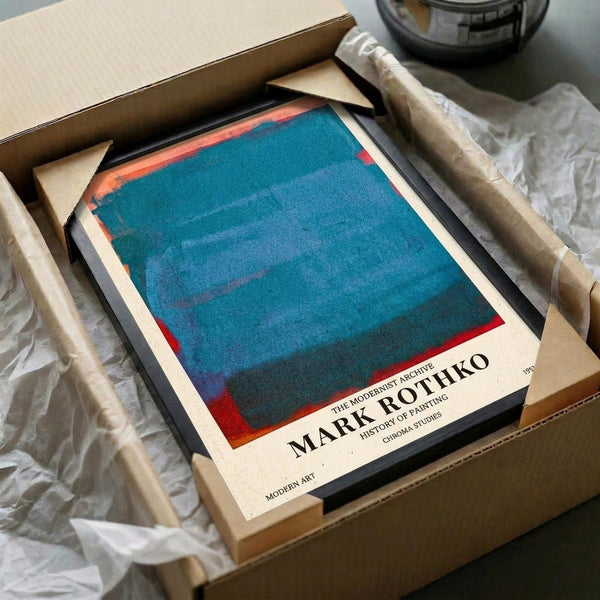 May include: Mark Rothko art book with blue and red abstract painting on cover, nestled in cardboard shipping box with white tissue paper and wooden dowel tubes for protection. The book shows a modernist color field composition with deep turquoise blue center section bordered by coral red edges on cream paper.