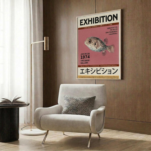 May include: Pink and cream exhibition poster with pufferfish illustration hanging on wood-paneled wall above beige upholstered armchair with geometric pillow. Modern floor lamp with brass finish and round marble base stands beside chair. Dark round side table with open book visible on left. Warm wood textures throughout minimalist interior setting.