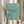 May include: Hands holding a framed art print showing three swimmers diving through turquoise blue water with Japanese text on the right side and "FINISH THE RACE NO MATTER WHAT IT TAKES" at the top. Natural wood frame against white curtained window with dried pampas grass stems visible on the left side.
