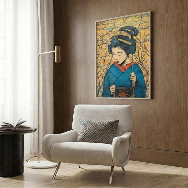 May include: Japanese art print featuring a geisha in blue kimono with red collar against golden cherry blossom background, displayed on wood-paneled wall above modern beige armchair with geometric pillow, brass floor lamp and side table visible in contemporary room setting.