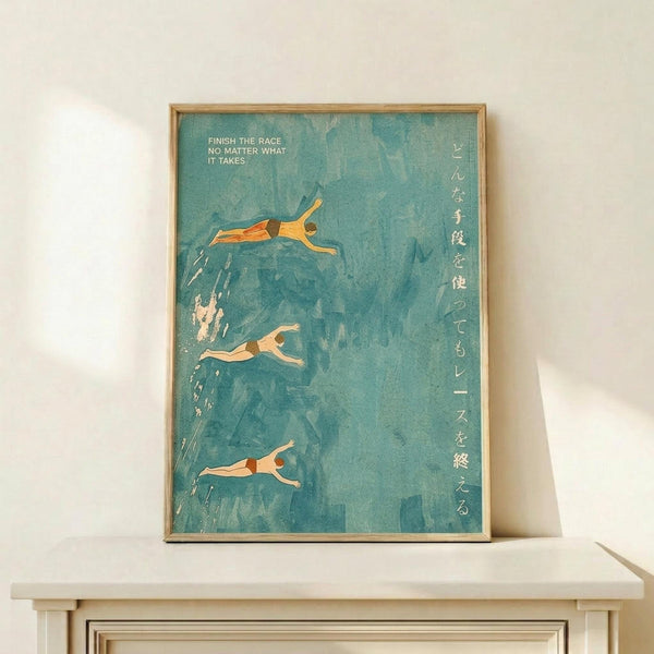 May include: Framed poster with turquoise blue watercolor background showing three swimmers diving or swimming, with English text "FINISH THE RACE NO MATTER WHAT IT TAKES" and vertical Japanese characters on the right side. Thin wooden frame sits on white wooden shelf against cream wall with natural lighting casting soft shadows.