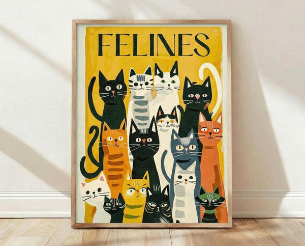 May include: Framed vintage-style cat illustration poster leaning against white wall on wooden floor. Yellow background features collection of stylized cats in various colors - black, orange, white, gray, striped - with geometric folk art design. Natural wood frame surrounds the print in bright room setting with natural lighting casting shadows on textured white wall.