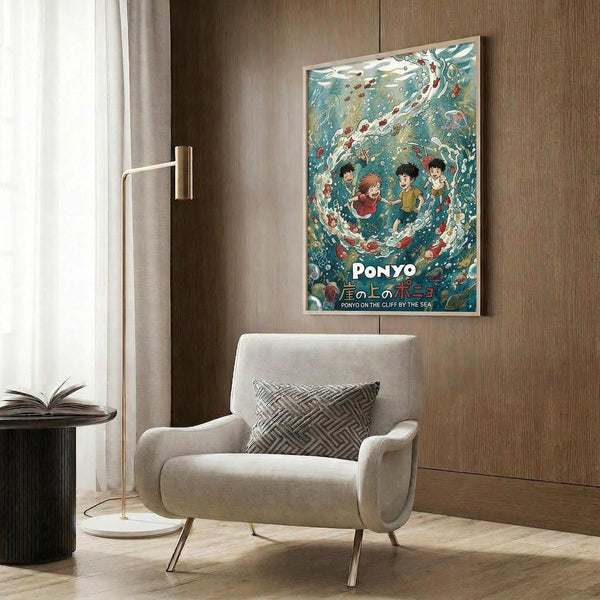 May include: A framed poster showing animated characters surrounded by swirling blue-green ocean water with fish and sea creatures. The artwork features Studio Ghibli-style animation with Japanese and English text at the bottom. The poster is displayed on a wood-paneled wall above a beige upholstered armchair with geometric patterned pillow. A modern brass floor lamp and side table with open book complete the contemporary living room setting.