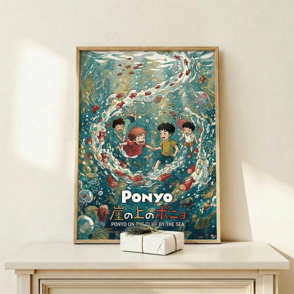May include: Framed poster displaying underwater scene with animated children swimming among jellyfish, fish, and swirling ocean currents in vibrant blues and teals. White text reads "PONYO" with Japanese characters below. Light wood frame sits on pale wooden shelf next to small white wrapped gift box against cream wall.