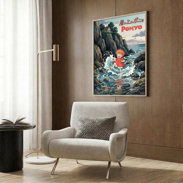 May include: Vintage-style Ponyo movie poster mounted on wood-paneled wall above beige armchair with geometric pillow. Poster shows red-haired child character splashing in ocean waves near rocky cliffs with Japanese text. Room features brass floor lamp, dark round side table with open book, and neutral modern decor.