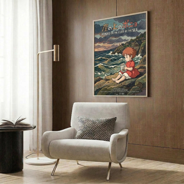 May include: Studio Ghibli Ponyo on the Cliff by the Sea movie poster mockup displayed in modern living room with beige armchair, geometric pillow, gold floor lamp, and dark wood wall panels. Poster shows red-haired child character sitting on rocky coastline with Japanese text at top.