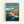 Framed poster featuring Ponyo, the red-haired fish girl character, running on water near a rocky coastline. The artwork shows a charming seaside village with colorful houses perched on cliffs in the background. Japanese text appears at the top with English translation "Ponyo on the Cliff by the Sea" below. The illustration uses vibrant blues for the ocean, warm earth tones for the rocks, and bright colors for the character and buildings in classic Studio Ghibli animation style.