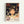 May include: Framed poster featuring anime character Chihiro from Spirited Away with short brown hair and worried expression, surrounded by swirling white spirits. Background shows mystical bathhouse interior with warm orange and green lighting, arched doorways and traditional architecture. Japanese and English text at bottom reads "Spirited Away" with "The Unseen World Awaits" tagline. Light wood frame against white wall.