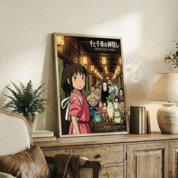 May include: Framed Spirited Away movie poster featuring Chihiro in red outfit with various animated characters in traditional Japanese street scene with paper lanterns, displayed on rustic wooden sideboard alongside books, ceramic vase, and fern plant in cozy living room setting with beige armchair and neutral walls.