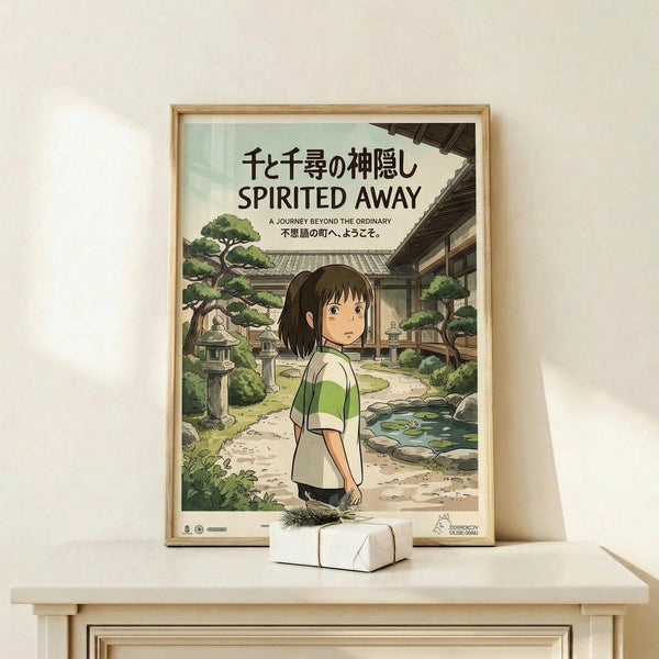 May include: Framed Spirited Away movie poster in light wood frame displayed on white wooden shelf against cream wall. Poster shows anime girl with brown bob haircut in green and white striped shirt standing in traditional Japanese garden setting with stone lanterns, trees, pond, and wooden buildings. Small white decorative box sits on shelf in front of frame.