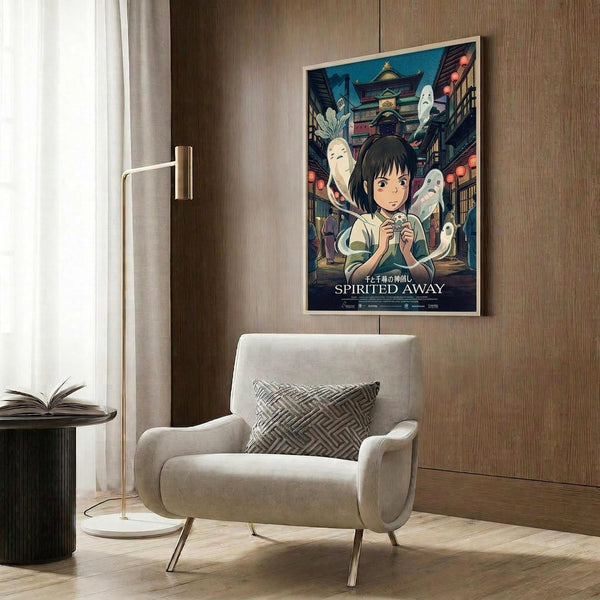 May include: Framed Spirited Away movie poster hanging on wood-paneled wall above beige upholstered armchair with geometric patterned throw pillow. Poster shows young girl character surrounded by white spirits and traditional Japanese architecture in rich blues and warm tones. Modern floor lamp with brass finish and circular base stands nearby next to small round table with open book.