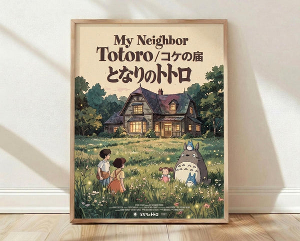 May include: Framed Studio Ghibli My Neighbor Totoro movie poster mockup leaning against white wall on wooden floor. Cream-colored poster features iconic gray Totoro character with smaller blue Totoro in grassy meadow scene with children, cozy house with glowing windows surrounded by green trees in background. Natural wood frame, soft window lighting creates shadows on textured white wall.