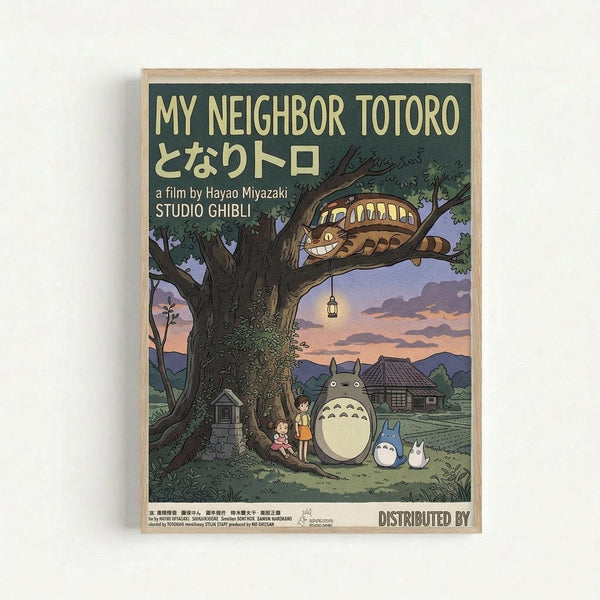 A framed vintage-style poster featuring characters from My Neighbor Totoro under a large tree at twilight. The artwork shows Totoro and smaller forest spirits with two children beside a massive tree trunk, while the Cat Bus perches in the branches above. A traditional Japanese house sits in the background under a purple-orange sunset sky. The poster has a dark green background with cream text reading "MY NEIGHBOR TOTORO" and Japanese characters, along with "a film by Hayao Miyazaki STUDIO GHI