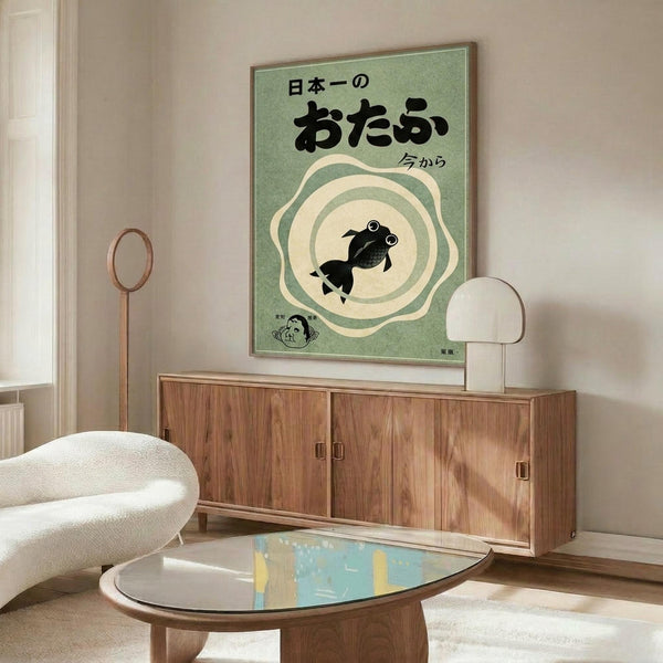 May include: Japanese poster print with green background featuring black goldfish character surrounded by cream-colored swirls, displayed above wooden mid-century modern credenza in minimalist living room with white curved chair, glass coffee table, and warm natural lighting