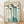 May include: Framed vintage Chinese ink painting featuring five blue-green cranes with red-orange heads and long dark beaks, surrounded by traditional black calligraphy text on cream paper. The wooden-framed artwork leans against a white wall on light wood flooring with soft shadows cast across the scene.