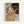 May include: Framed reproduction of an expressionist painting showing two nude figures in an intimate embrace, rendered in earthy tones of pink, green, and brown with bold black outlines. The artwork features Schiele's characteristic angular style and emotional intensity, displayed in a light wood frame against a white wall.