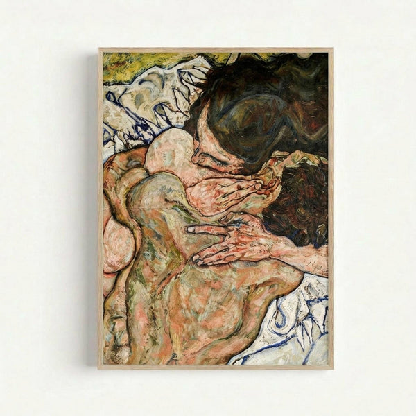 May include: Framed reproduction of an expressionist painting showing two nude figures in an intimate embrace, rendered in earthy tones of pink, green, and brown with bold black outlines. The artwork features Schiele's characteristic angular style and emotional intensity, displayed in a light wood frame against a white wall.