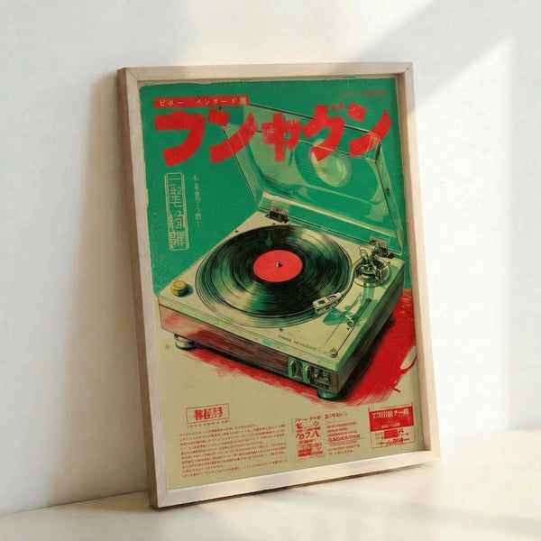 May include: Framed vintage Japanese advertisement poster featuring a turntable record player with green and red color scheme, displayed against white wall. The retro-style artwork shows detailed turntable illustration with Japanese text, housed in light wooden frame, leaning at slight angle on floor or surface.