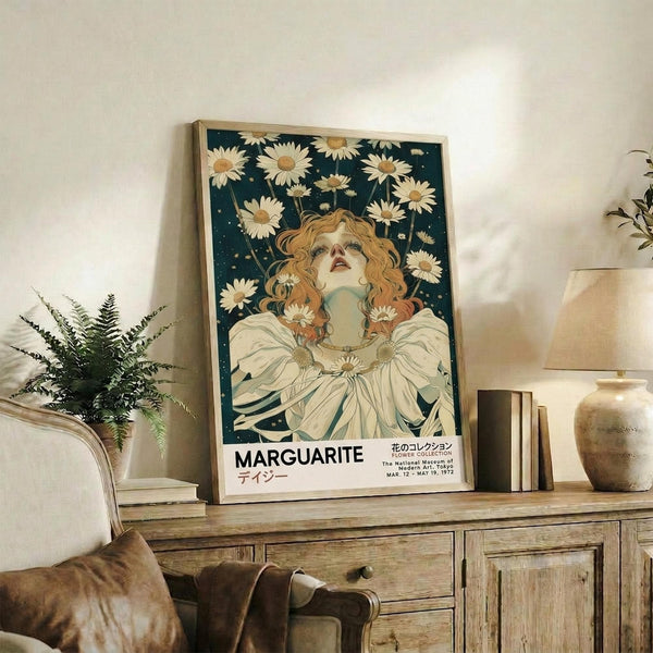 May include: Vintage-style poster featuring woman with flowing red hair surrounded by white daisies against dark teal background, displayed in light wood frame on rustic wooden sideboard. Room setting shows fern plant, pottery vase, books, and beige upholstered furniture creating warm, bohemian interior aesthetic.