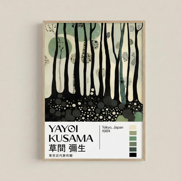 Forest scene artwork with black tree trunks against cream background and green circular shapes. Bottom shows black ground with white dots and circles representing forest floor. Text reads "YAYOI KUSAMA" with Japanese characters below, "Tokyo, Japan 1984" and museum attribution. Color palette strip on right shows greens to black gradation. Modern minimalist style in light wood frame hung on white wall.
