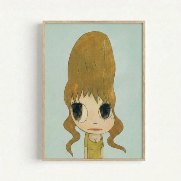 Framed artwork showing a cartoon-style character with an exaggerated tall golden blonde beehive hairdo and large dark eyes against a pale mint green background. The figure has a melancholic expression with bangs covering part of their face and wears a yellow-green top. The piece is displayed in a simple light wood frame on a white wall, rendered in a distinctive Japanese pop art aesthetic with muted earth tones.