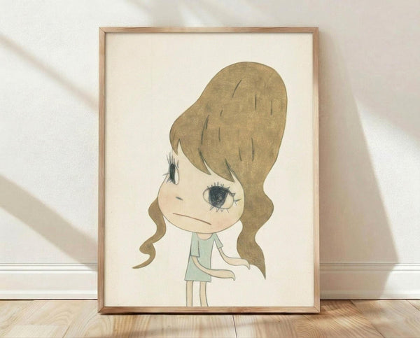 May include: Framed art print featuring a stylized cartoon girl with large blonde beehive hair and oversized eyes, wearing a mint green dress. The illustration has a minimalist style with soft colors on cream background, displayed in a light wood frame leaning against a white textured wall on wooden flooring with natural lighting creating gentle shadows.