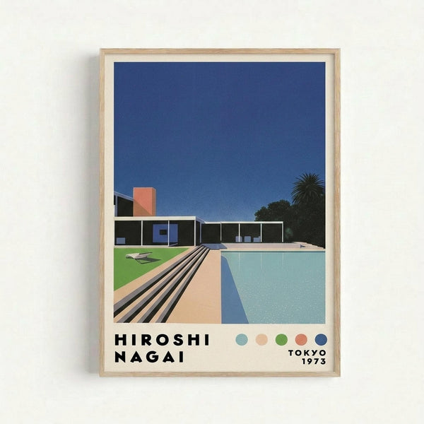 Framed poster print featuring a minimalist illustration of a modern house with swimming pool in retro aesthetic. The artwork shows a sleek single-story building with large windows, orange chimney, and palm tree against a deep blue sky. A turquoise rectangular pool dominates the foreground with tan decking and black striped shadows. Green lawn with lounge chairs visible on the left. Text reads "HIROSHI NAGAI" and "TOKYO 1973" with small colored dots below. Light wood frame against white w
