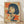 May include: Framed vintage-style poster featuring a woman with black bob haircut and bangs smoking a cigarette, rendered in retro Japanese pop art style with cream background and bold red Japanese characters. The artwork uses halftone shading and limited color palette of red, blue, and cream tones. Wooden frame sits against white wall on light wood flooring with natural shadows visible.