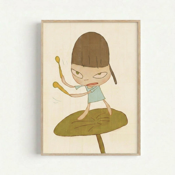 Framed artwork showing a cartoon-style girl with a brown bob haircut and green eyes, wearing a light blue top. She holds drumsticks with her arms raised, standing on top of a large green leaf or mushroom cap. The illustration has a whimsical, minimalist style with muted colors on a cream background, displayed in a light wood frame against a white wall.