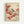 Japanese woodblock print style artwork showing a small songbird with black cap, white breast, and gray-blue wings perched on a branch heavy with clusters of bright red berries. The bird appears to be a chickadee or similar species, rendered in soft, naturalistic colors against a cream background. Additional berry-laden branches extend across the composition, with some berries appearing to fall. The delicate illustration is displayed in a simple light wood frame against a white wall.